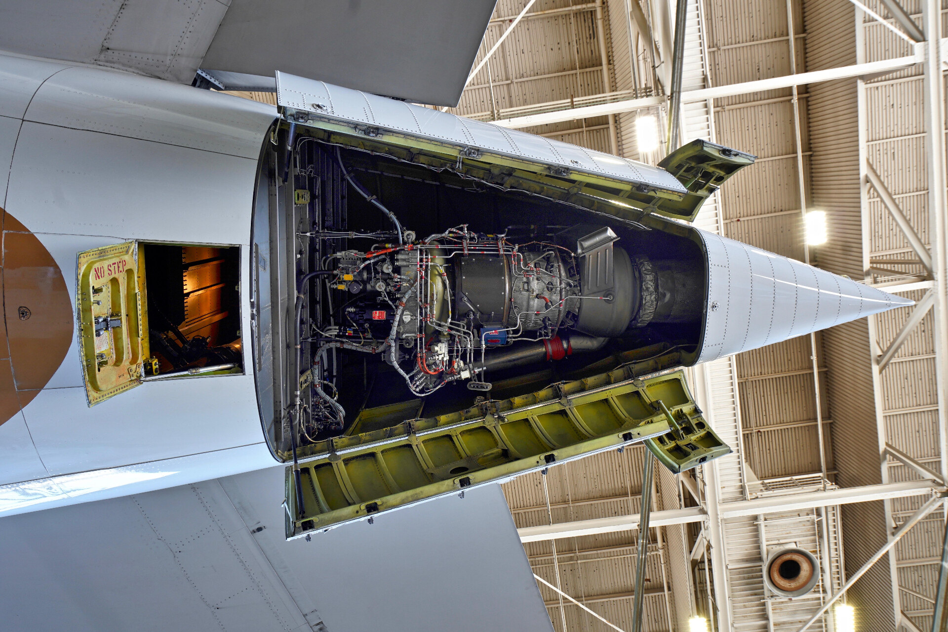 Aircraft auxiliary power unit (APU) installed in tail cone with access doors open